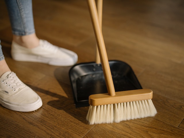 brooming a wooden floor