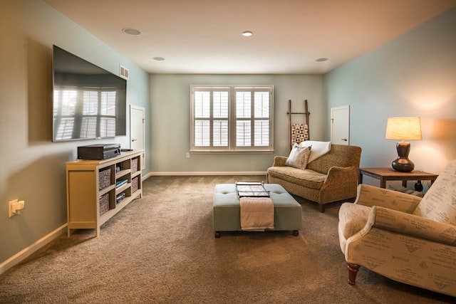 large living room with armchairs and a television