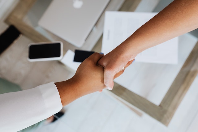 two people shaking hands